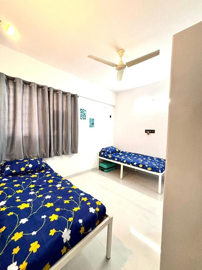 Cozy Bedding & Curtained Window Setup - Bhati Boys PG Warje Pune