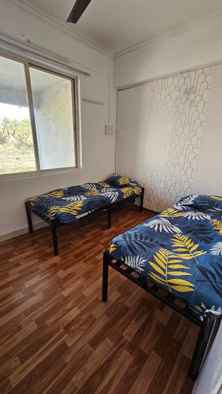 Sunlit Double Room with Tree Views - Bhati Boys PG Warje Pune