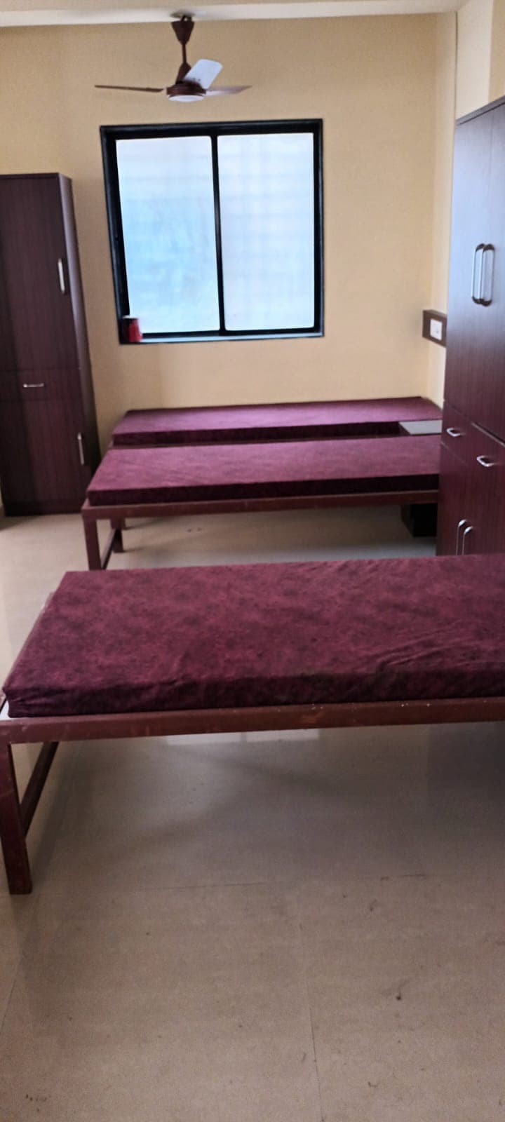 Sunny Bedroom with Wooden Storage - Bhati Boys PG Warje Pune