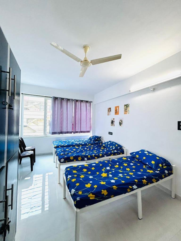 Sunlit Multi-Sharing Room - Bhati Boys PG Warje Pune